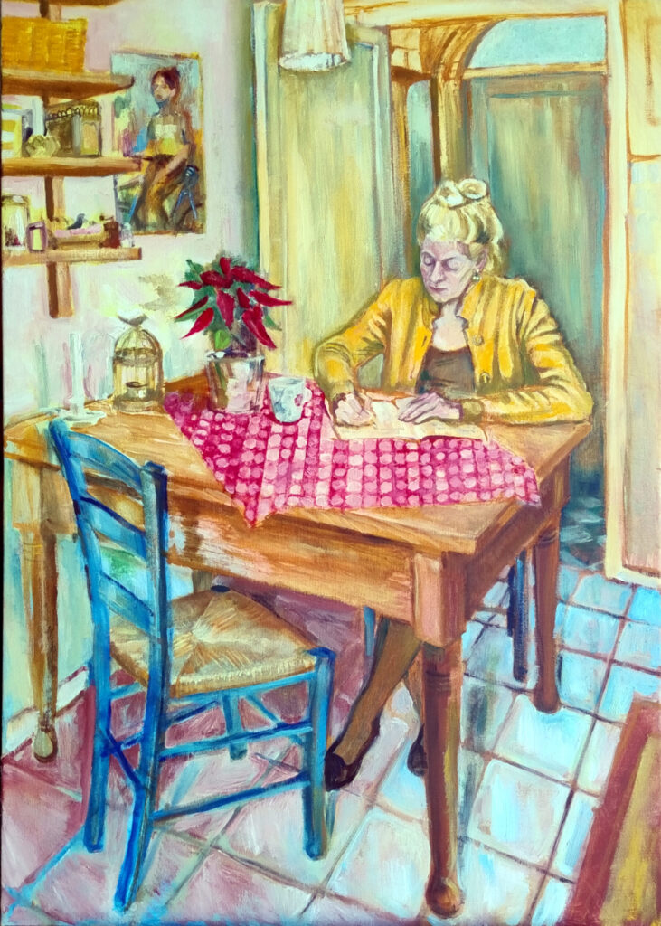 Woman sitting at a table and writing in a notebook.